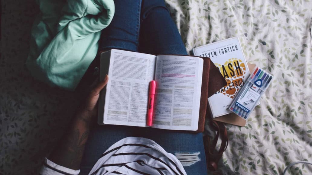A woman reading in her Sophrology journal