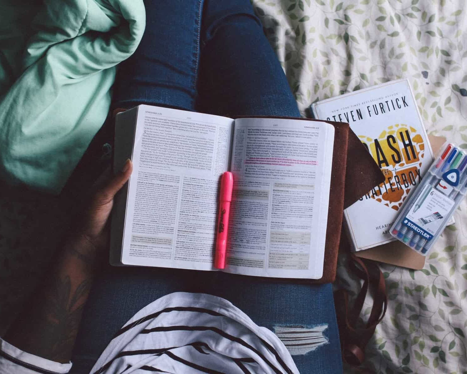 A woman reading in her Sophrology journal