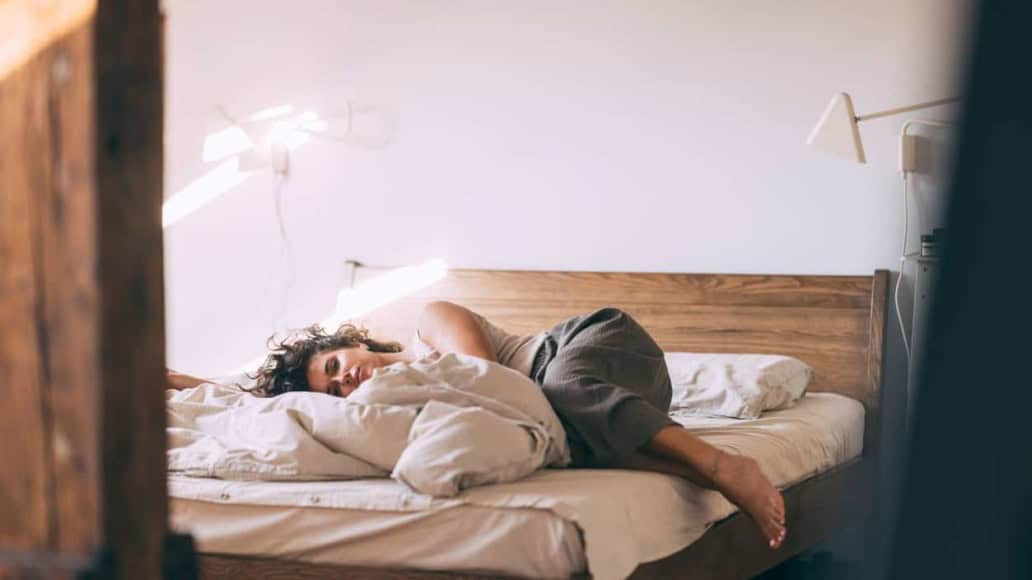 Woman sleeping in a bed