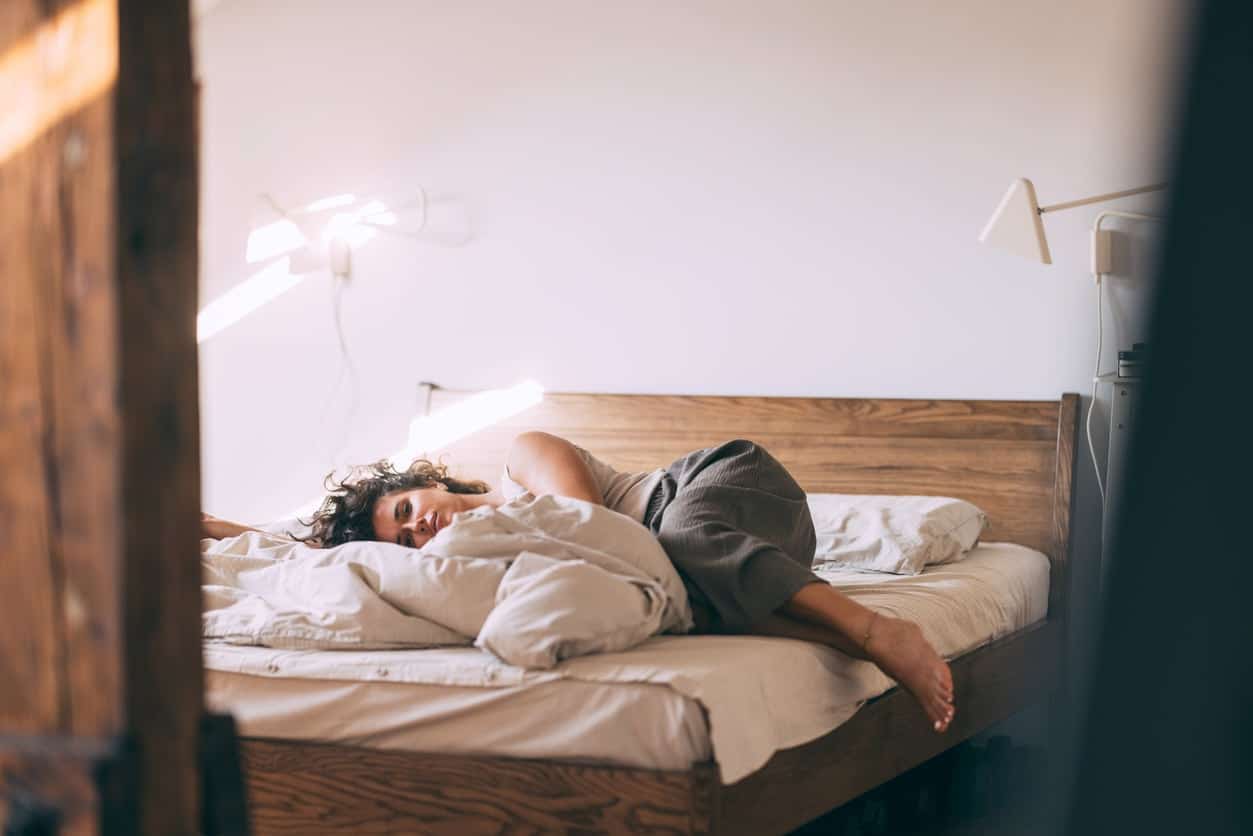 Woman sleeping in a bed