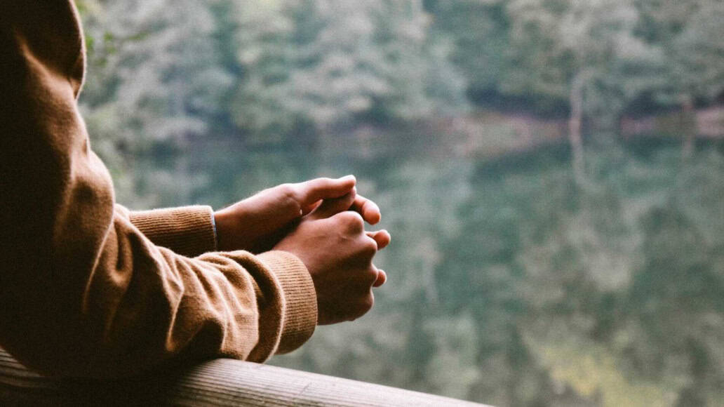 A person looking over a lake