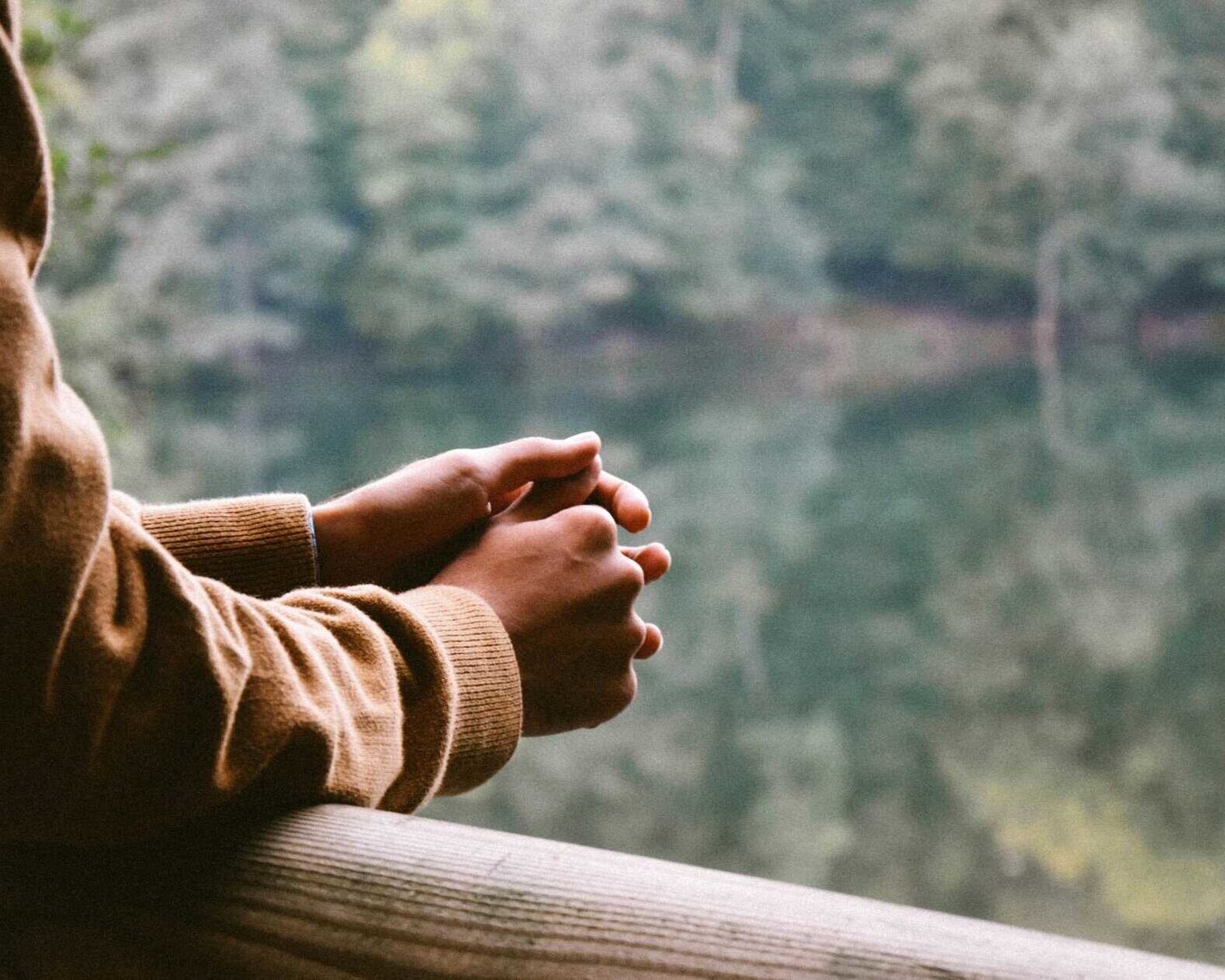 A person looking over a lake