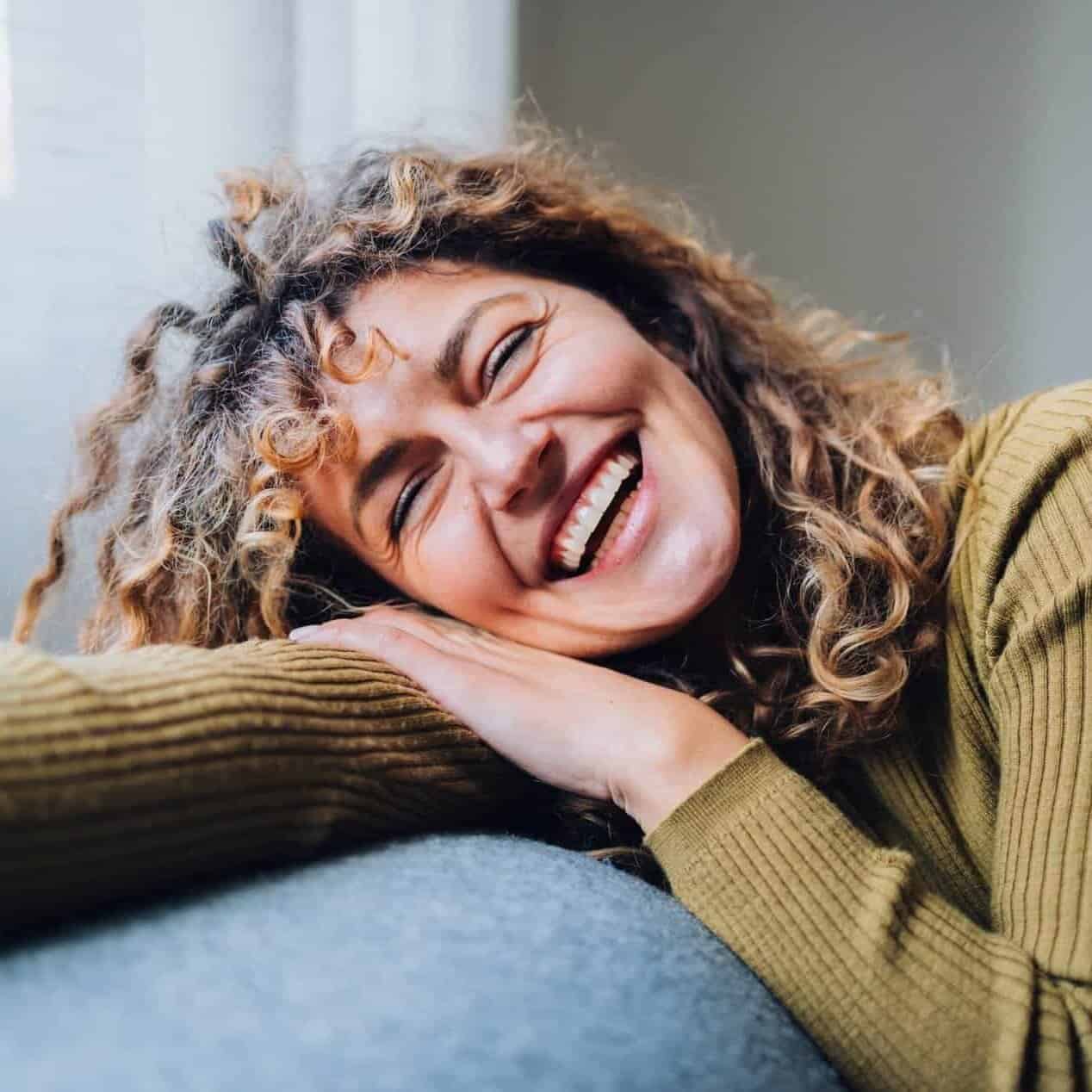 Women at Menopause age on sofa