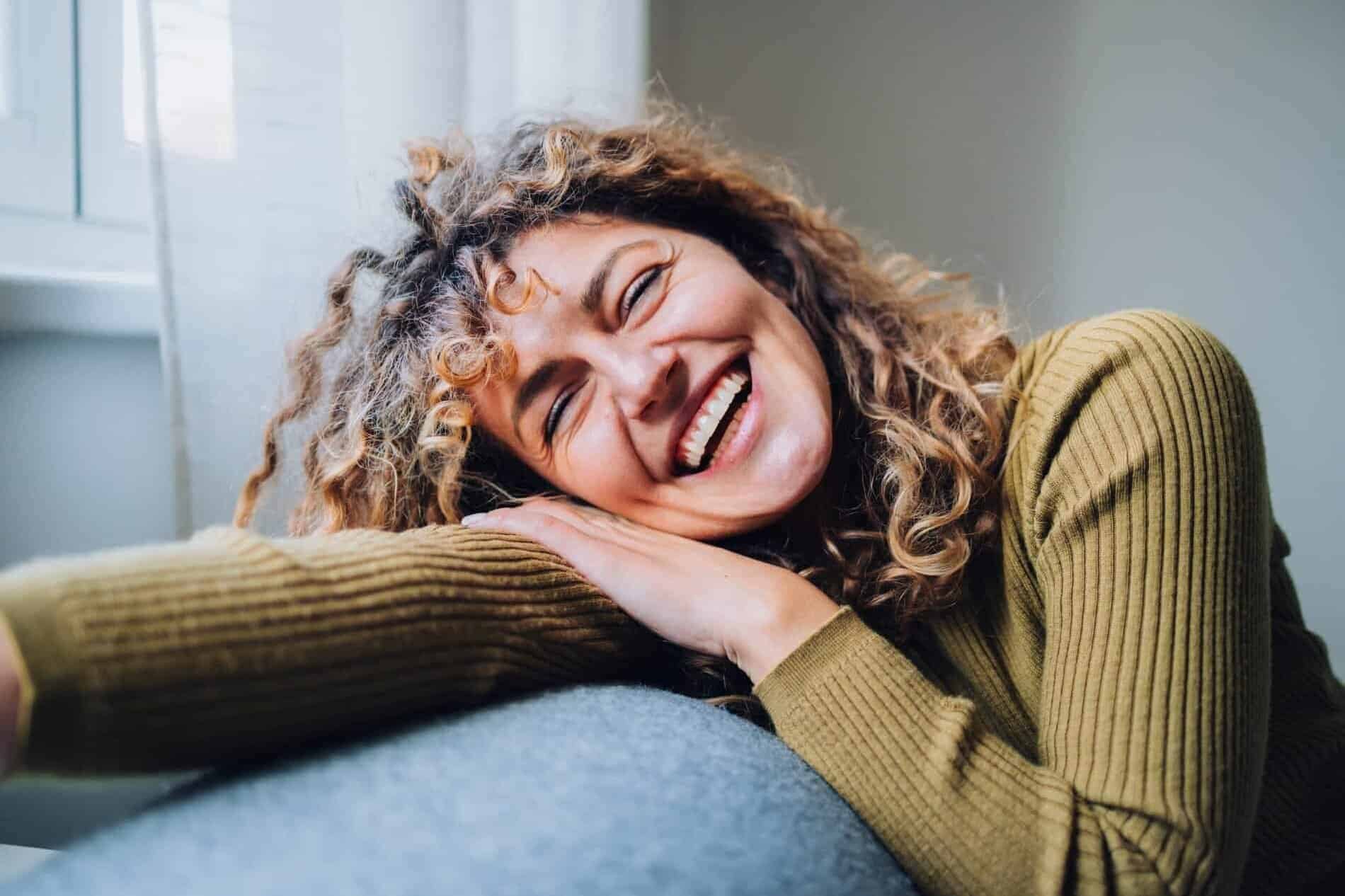 Women at Menopause age on sofa