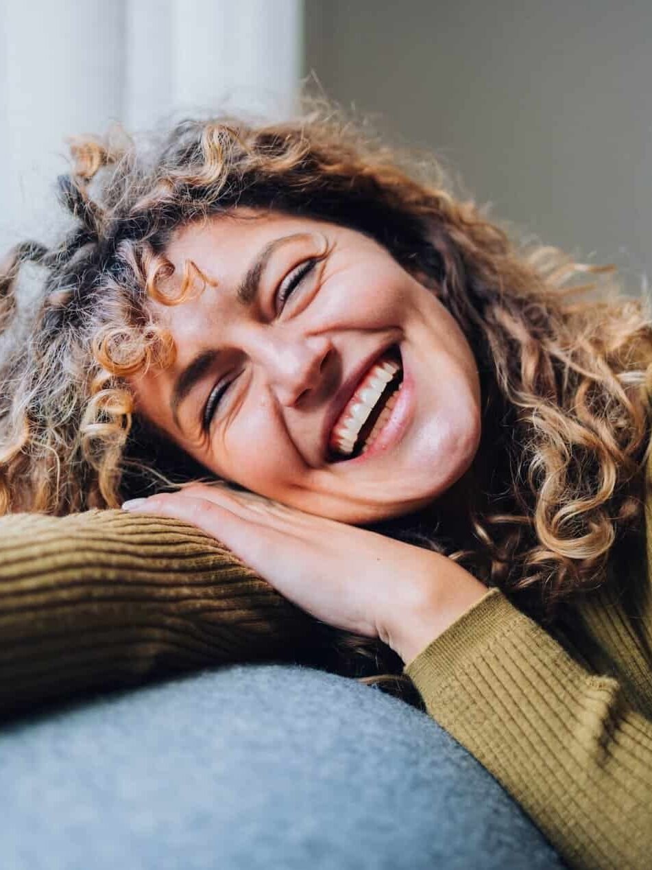 Women at Menopause age on sofa